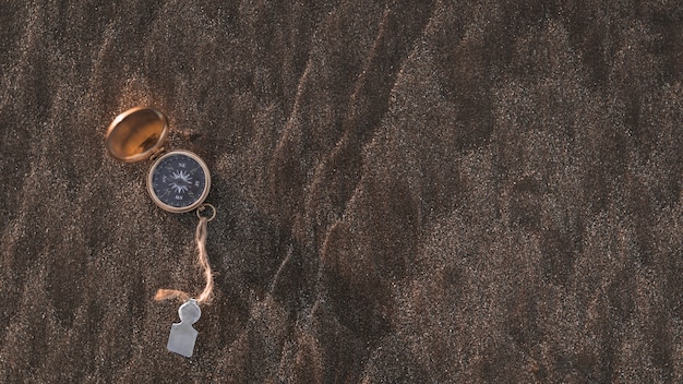 Free photo compass on stony surface