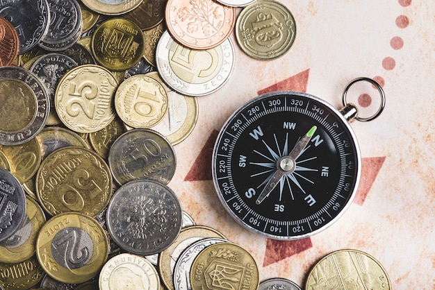 Compass with variety of coins