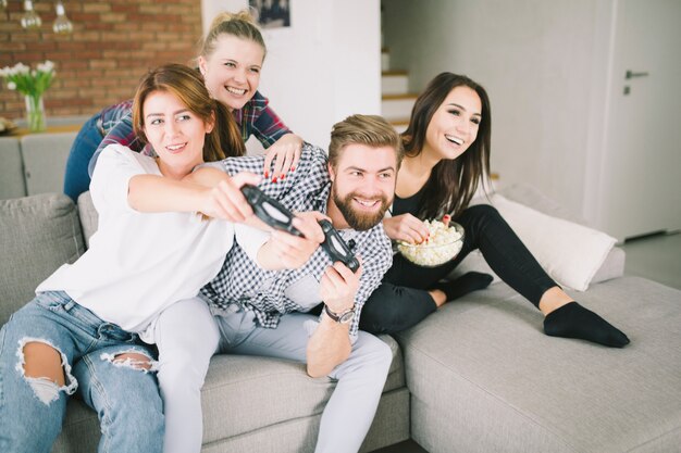 Competing friends playing game on party