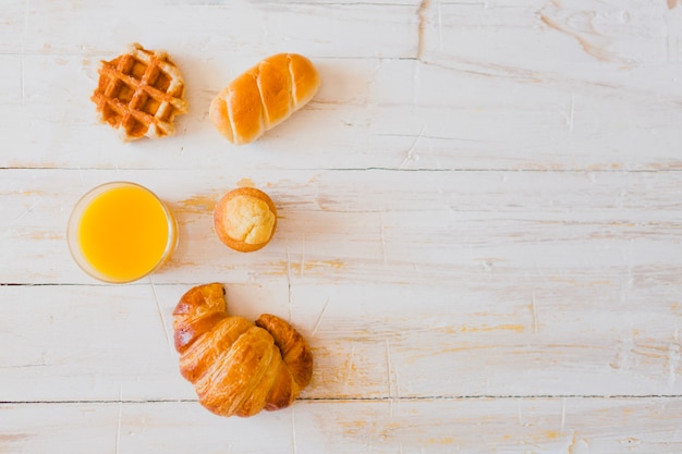 Composed buns and juice on table