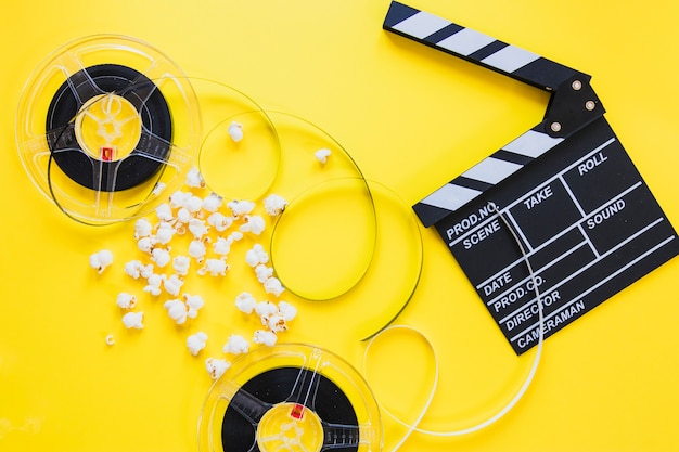 Free photo composed clapboard with reels