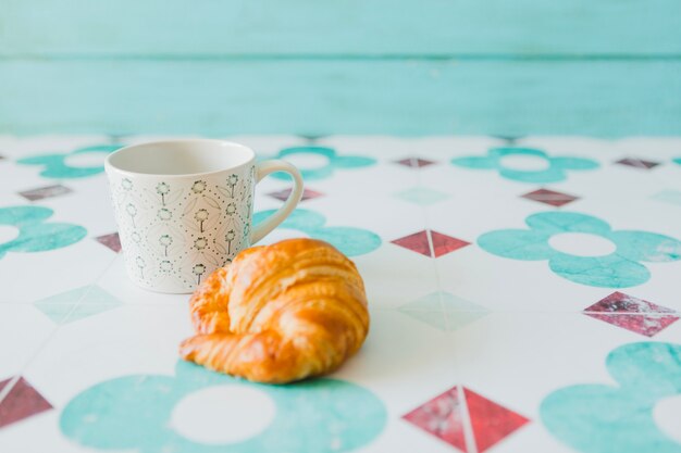 Composed sweet bun and coffee mug