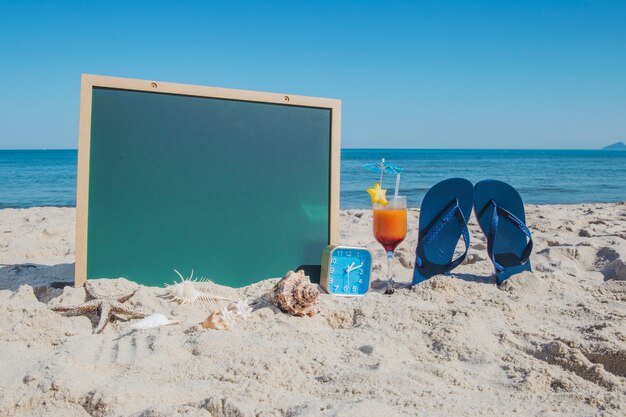 Composition on beach with items