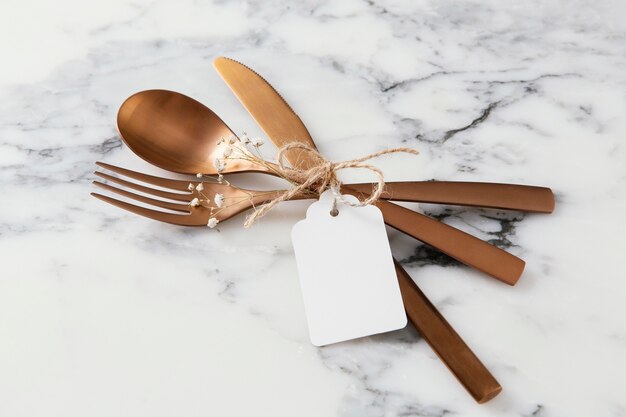 Composition of beautiful tableware with empty tag