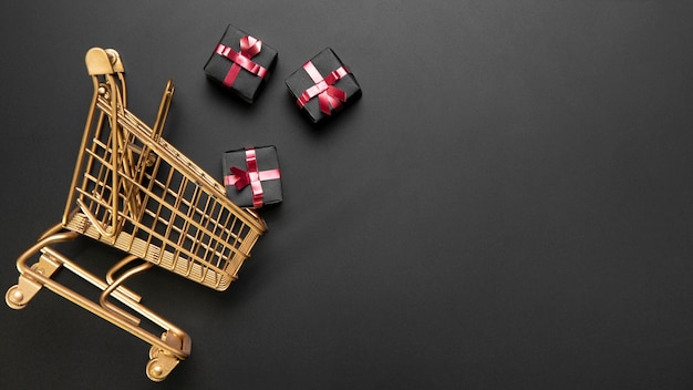 Composition of black friday shopping cart with copy space