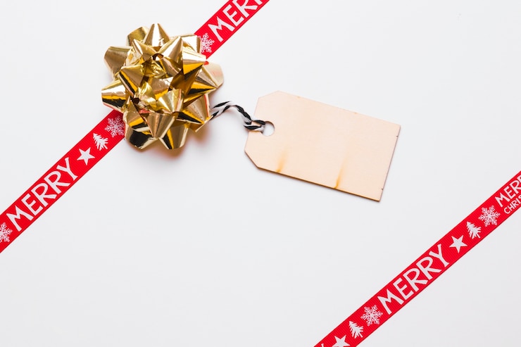 Free Photo composition of bow with christmas greeting card
