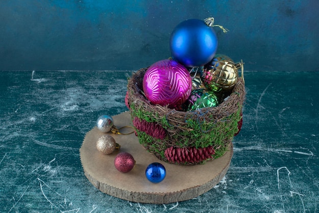 Composition of christmas baubles on blue.