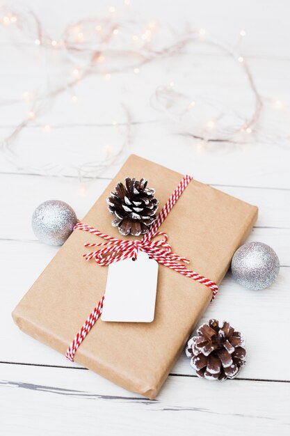 Composition of Christmas present with decorations and garland