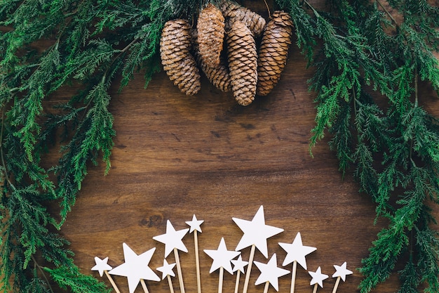 Free photo composition for christmas with cones and stars