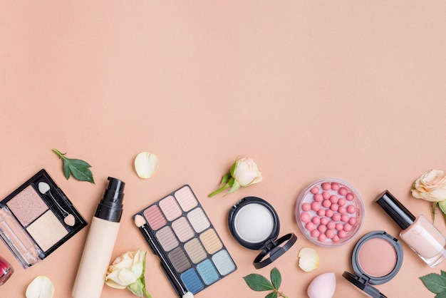 Composition of cosmetics with copy space on beige background