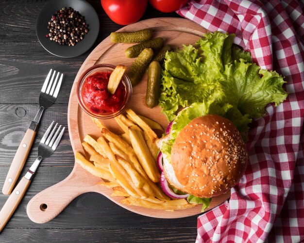 Composition of delicious hamburger and fries