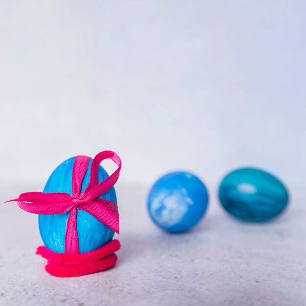 Composition of Easter eggs with ribbons