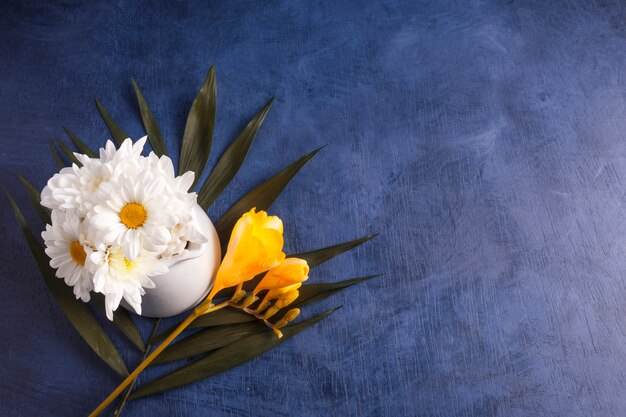 Composition of fresh flowers and tropical plant