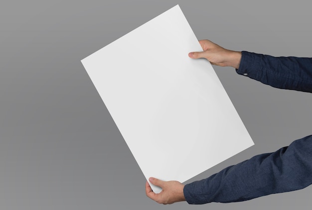 Composition of hands holding a large-format poster