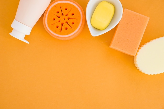 Composition of health care products on orange background