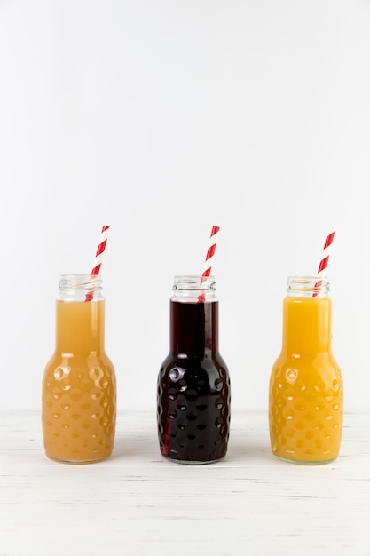 Free photo composition of juice with straws