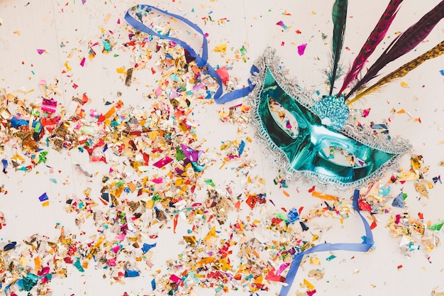 Composition of masquerade mask and glitters