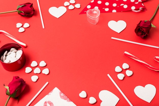 Free photo composition of paper hearts, flowers and wands