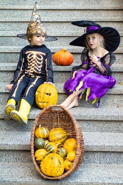 Composition of pumpkin and halloween decorations for children in garden happy halloween with sweets ...