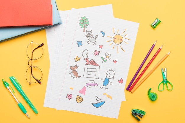 Composition of school stationery with drawing