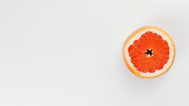 Free photo composition of slice of grapefruit