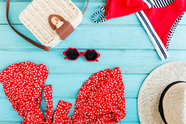 Composition of summer accessories on blue background