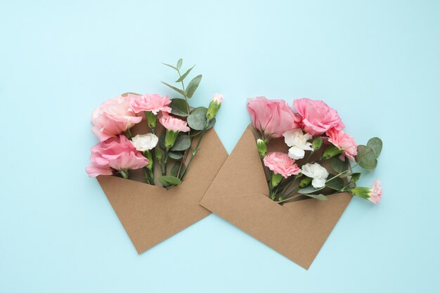 Composition with beautiful flowers and envelopes