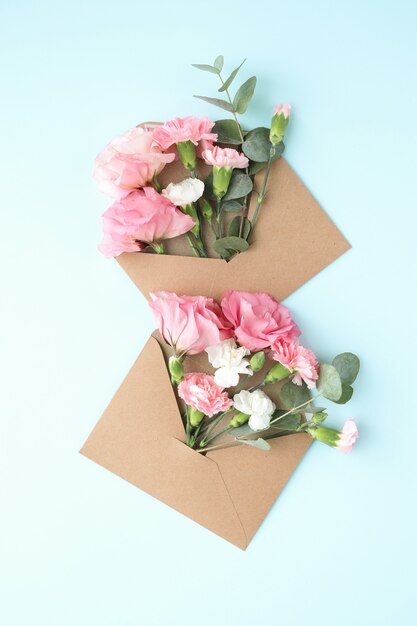 Composition with beautiful flowers and envelopes