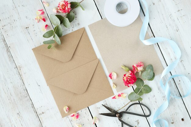 Composition with beautiful flowers and envelopes