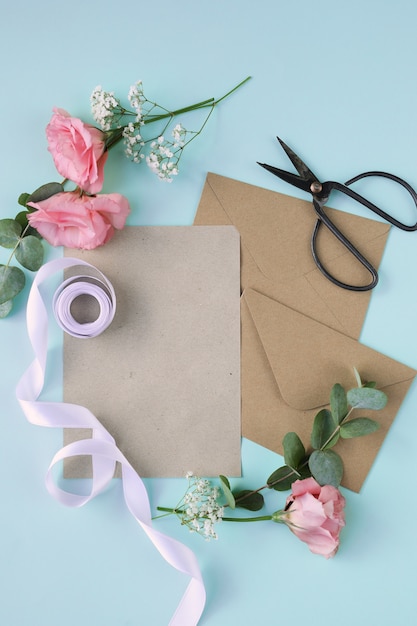 Composition with beautiful flowers and envelopes