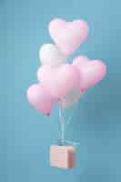 Бесплатное фото Композиция с милыми сердечками из воздушных шаров в коробке