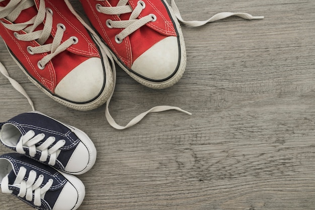 Free photo composition with decorative shoes on wooden surface