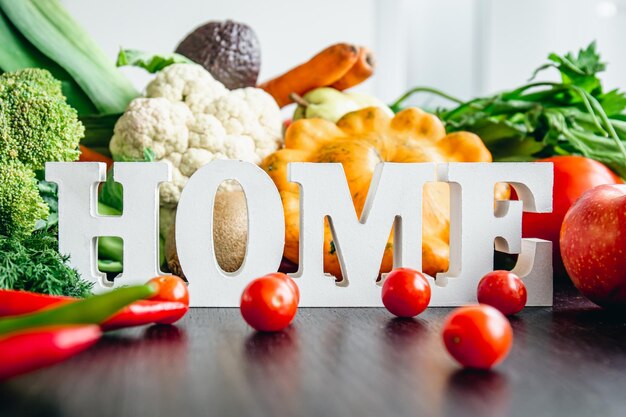 Composition with decorative word home and different vegetables