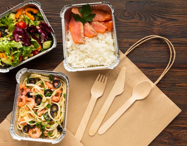 Composition with different meals on a wooden table