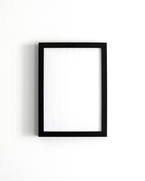 Composition with empty frame on wall