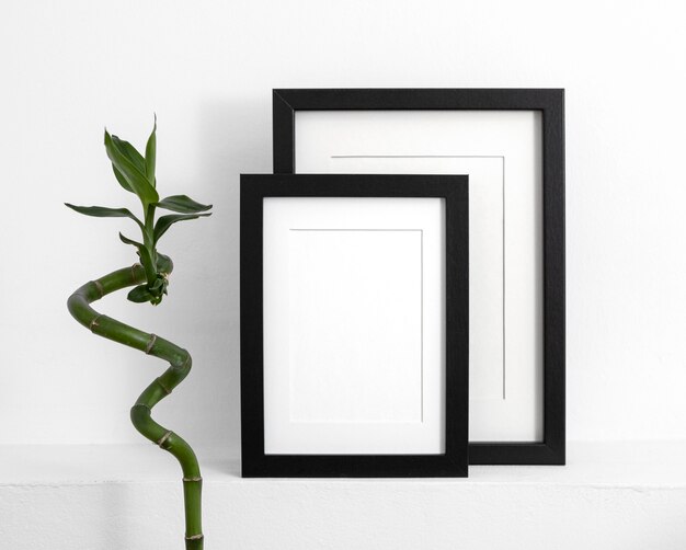Composition with empty frames on table