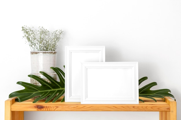 Composition with empty white frames indoors