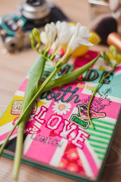 Composition with flower and book for mother's day