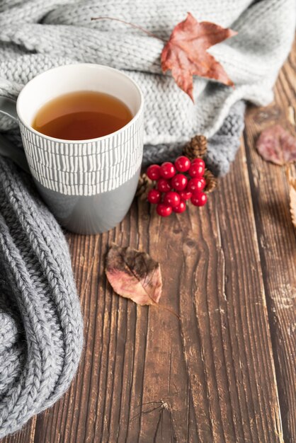 Composition with hot drink on wooden table