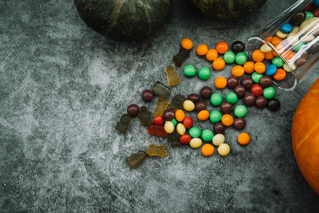 Composition with pumpkin and candies