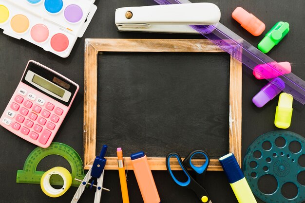 Composition with school materials and blackboard