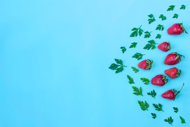 Composition with strawberries, parsley and blank space for messages