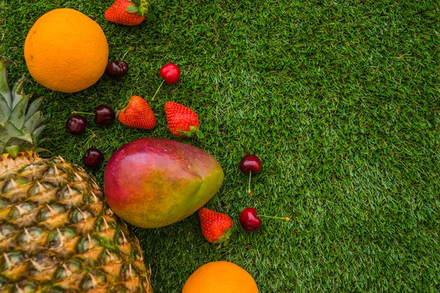 Composition with summer fruits and grass