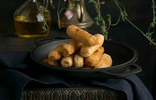 Free photo composition with traditional tequenos on a plate