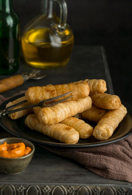 Composition with traditional tequenos on a plate