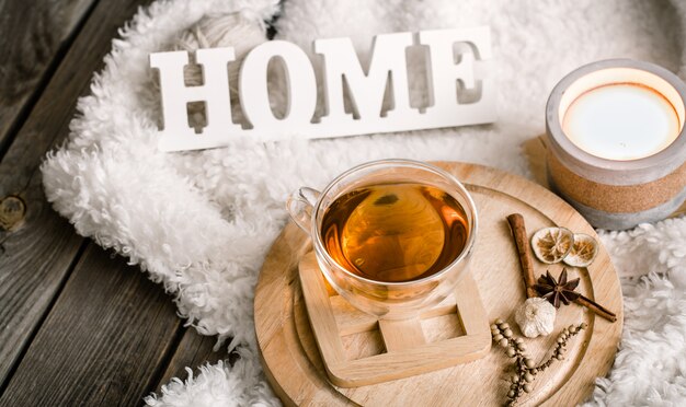 Composition with wooden letters and a Cup of tea