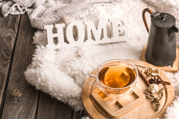 Composition with wooden letters and a Cup of tea