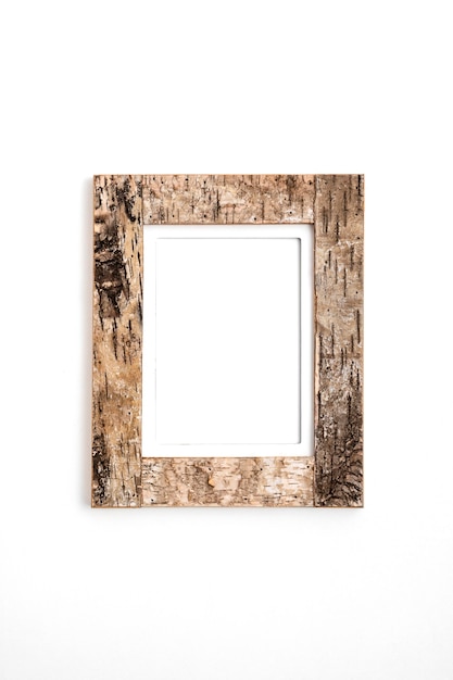 Composition of wooden empty frame on wall
