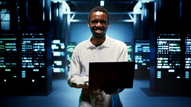 Free photo computer expert walking between servers