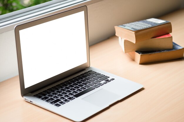 Computer laptop and old vintage book